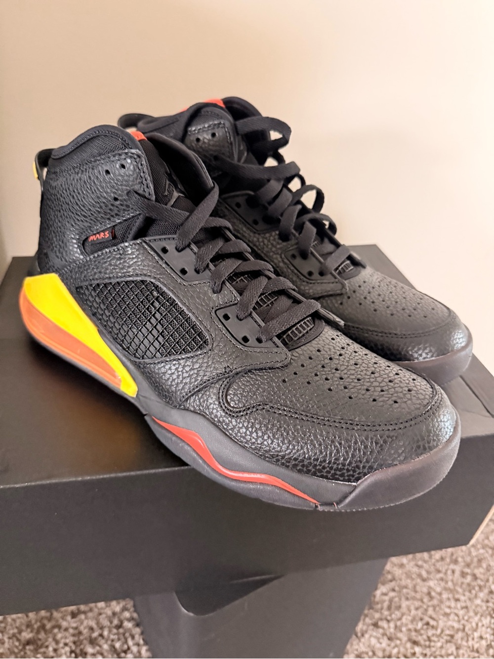 Air Jordan Mars 270 Men's Black Basketball Sneakers with Yellow & Red Accents